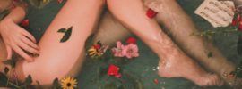A woman with beautiful legs in a bathtub